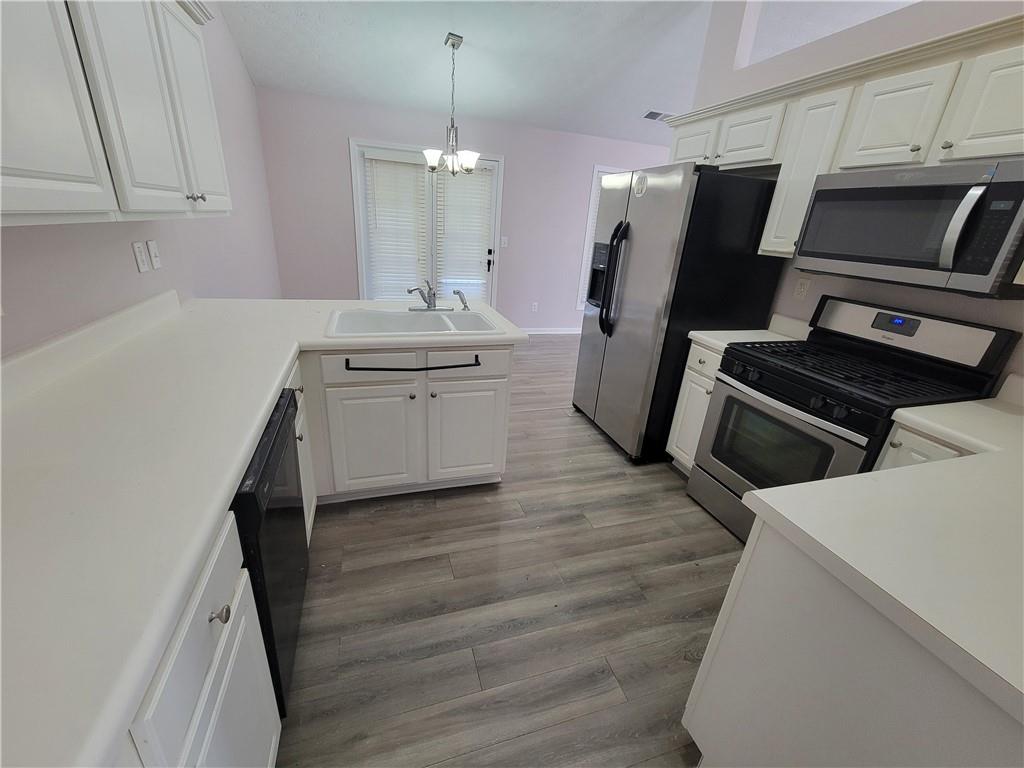 2213 Carlton Chase Road Dacula, GA 30019 - Photo 11 of 30 a kitchen with refrigerator and stove