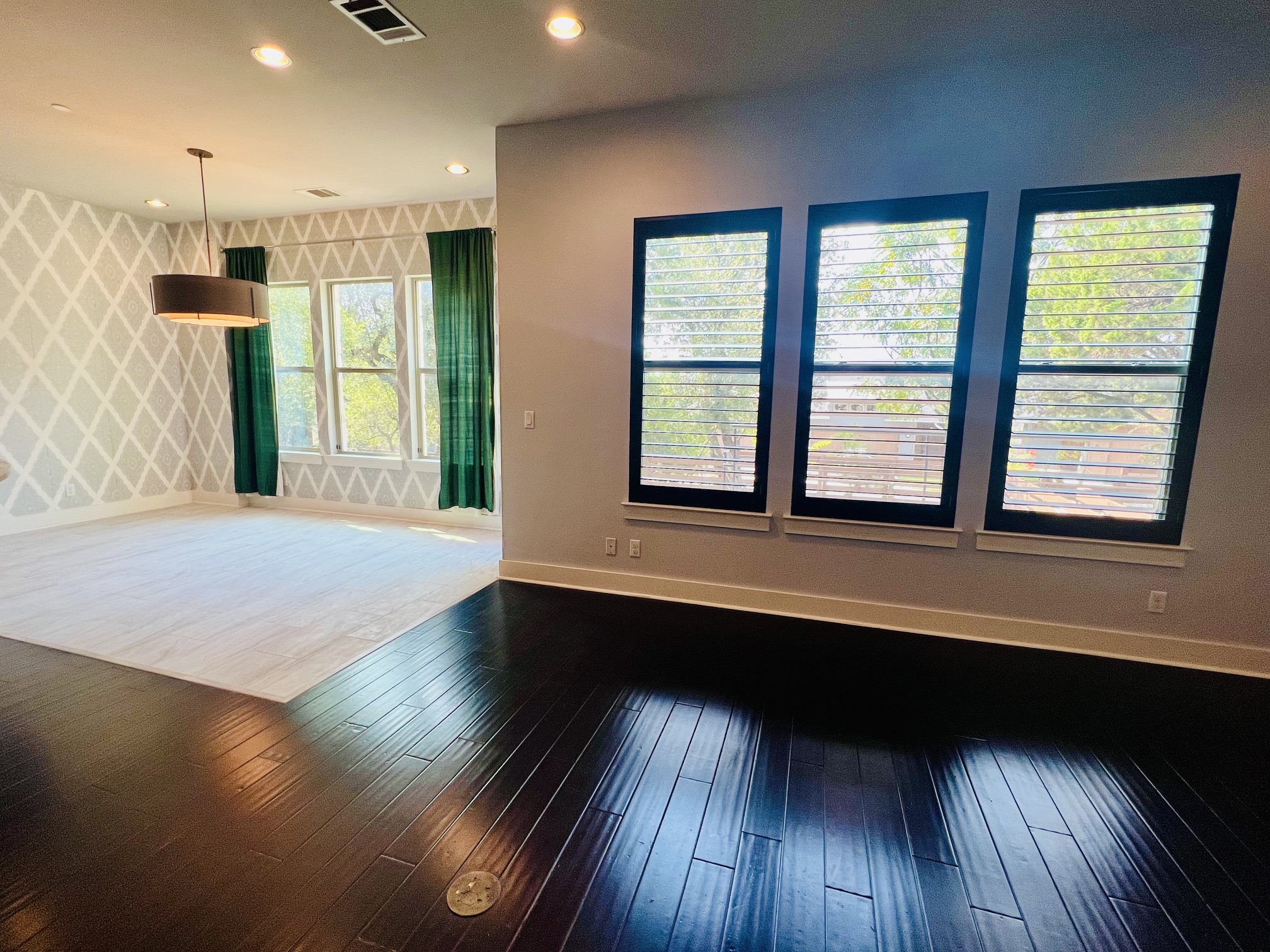 8110 Southeast Ranch Road 2222, Unit 98 Austin, TX 78730 - Photo 7 of 31 Rich dark hardwood floors and clean horizontal lines define this open-concept main level space.
