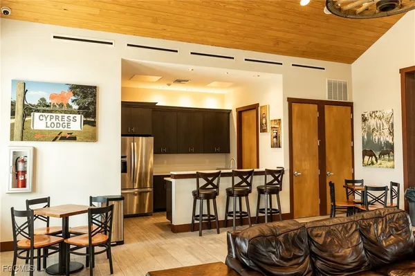 a view of a livingroom with furniture window and wooden floor