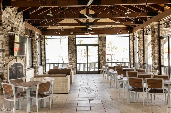 a view of a dining room with furniture window and outside view