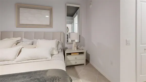 a large white bed in a white room