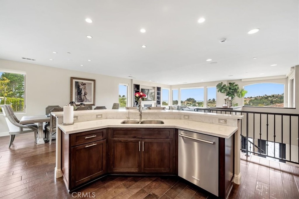 207 Princessa Lane Pismo Beach, CA 93449 - Photo 12 of 38 a kitchen with a sink and cabinets