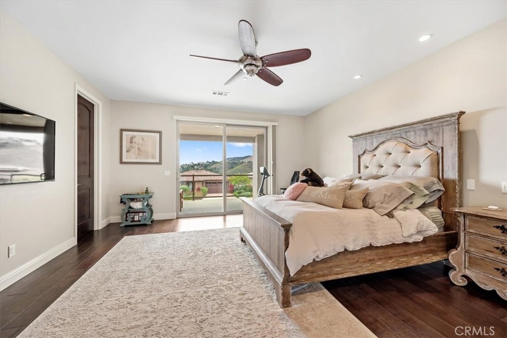 207 Princessa Lane Pismo Beach, CA 93449 - Photo 15 of 38 a bedroom with a large bed and a window