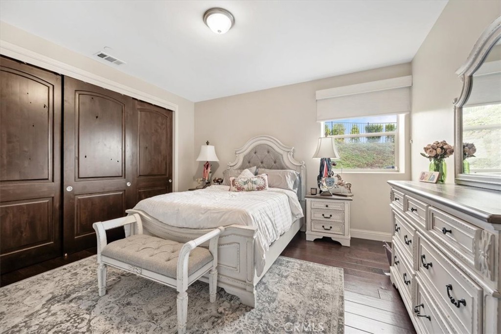 207 Princessa Lane Pismo Beach, CA 93449 - Photo 30 of 38 a bedroom with a bed and a dresser