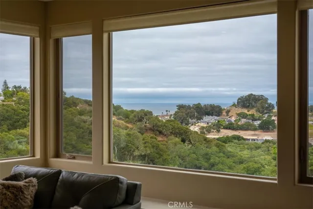 a view of a window and a couch in a living room