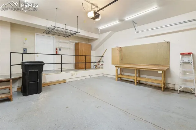 a bathroom with a granite countertop sink mirror and shower