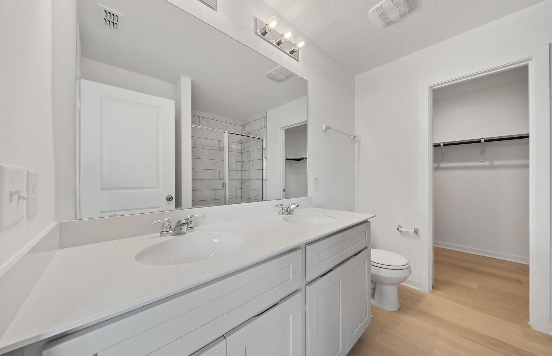 608 Rubber Tree Way Buda, TX 78610 - Photo 14 of 29 a view of bathroom with a sink mirror and toilet