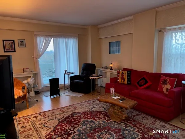 a living room with furniture or couch and a fireplace