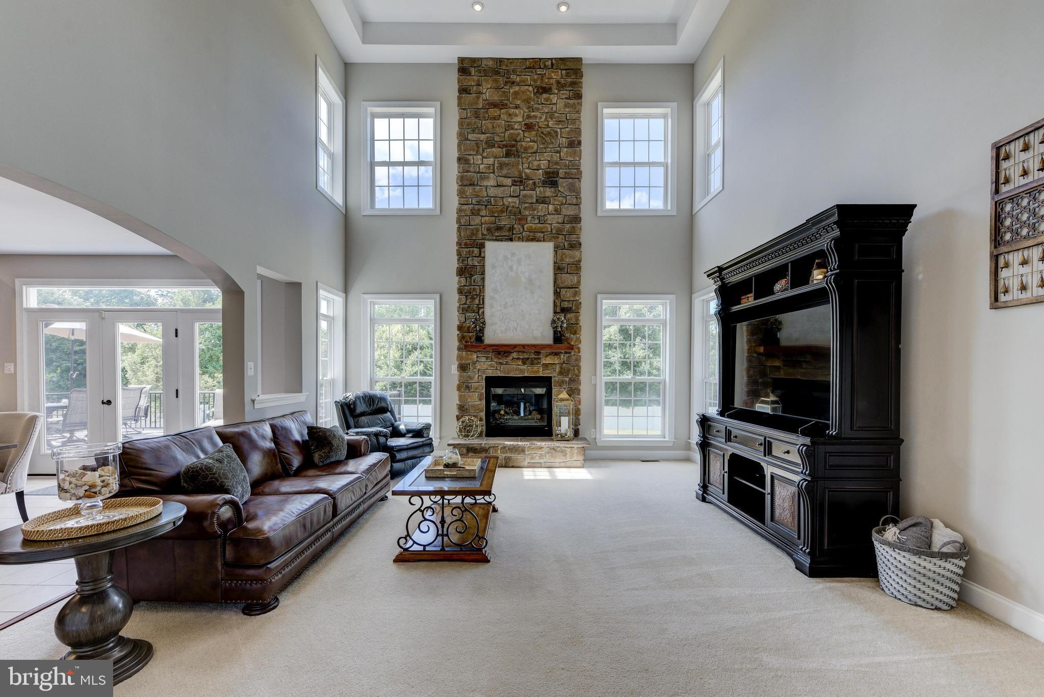 811 Castleton Drive Mickleton, NJ 08056 - Photo 11 of 52 a living room with furniture flat screen tv and a fireplace