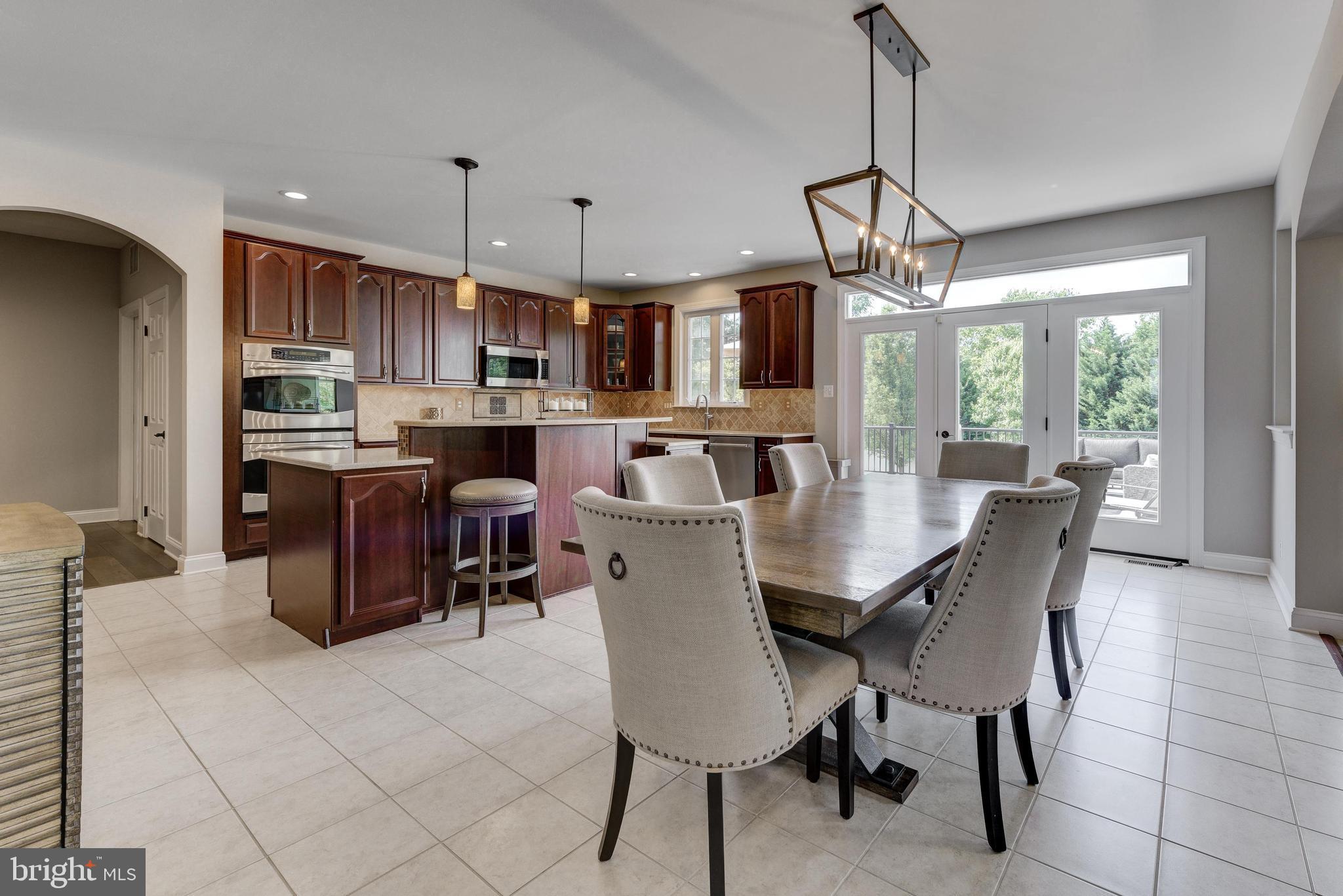 811 Castleton Drive Mickleton, NJ 08056 - Photo 14 of 52 a view of a dining room with furniture window and wooden floor