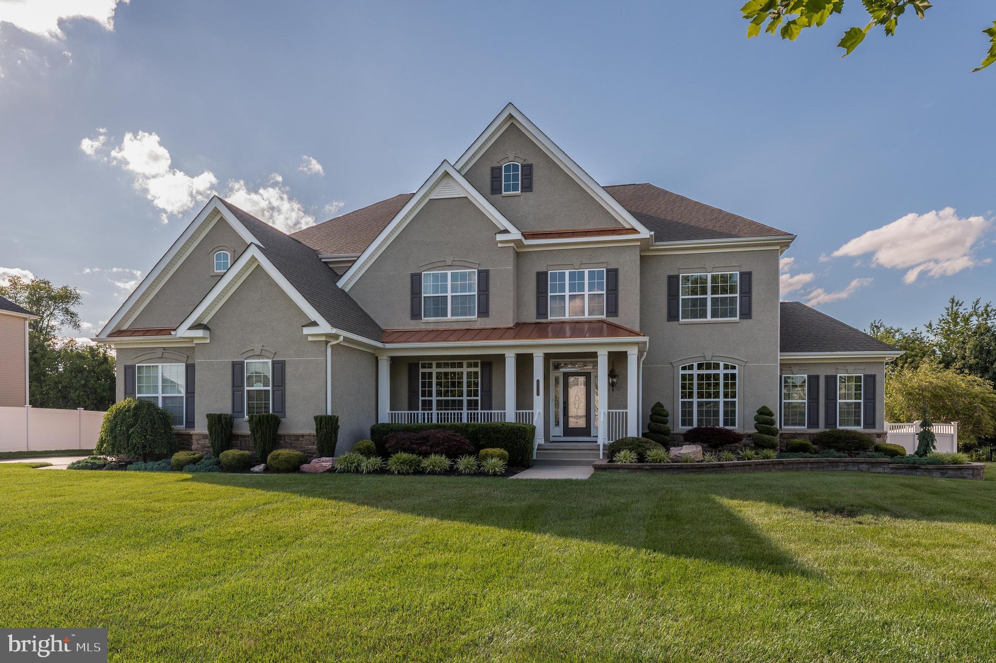 811 Castleton Drive Mickleton, NJ 08056 - Photo 2 of 52 a front view of a house with a yard