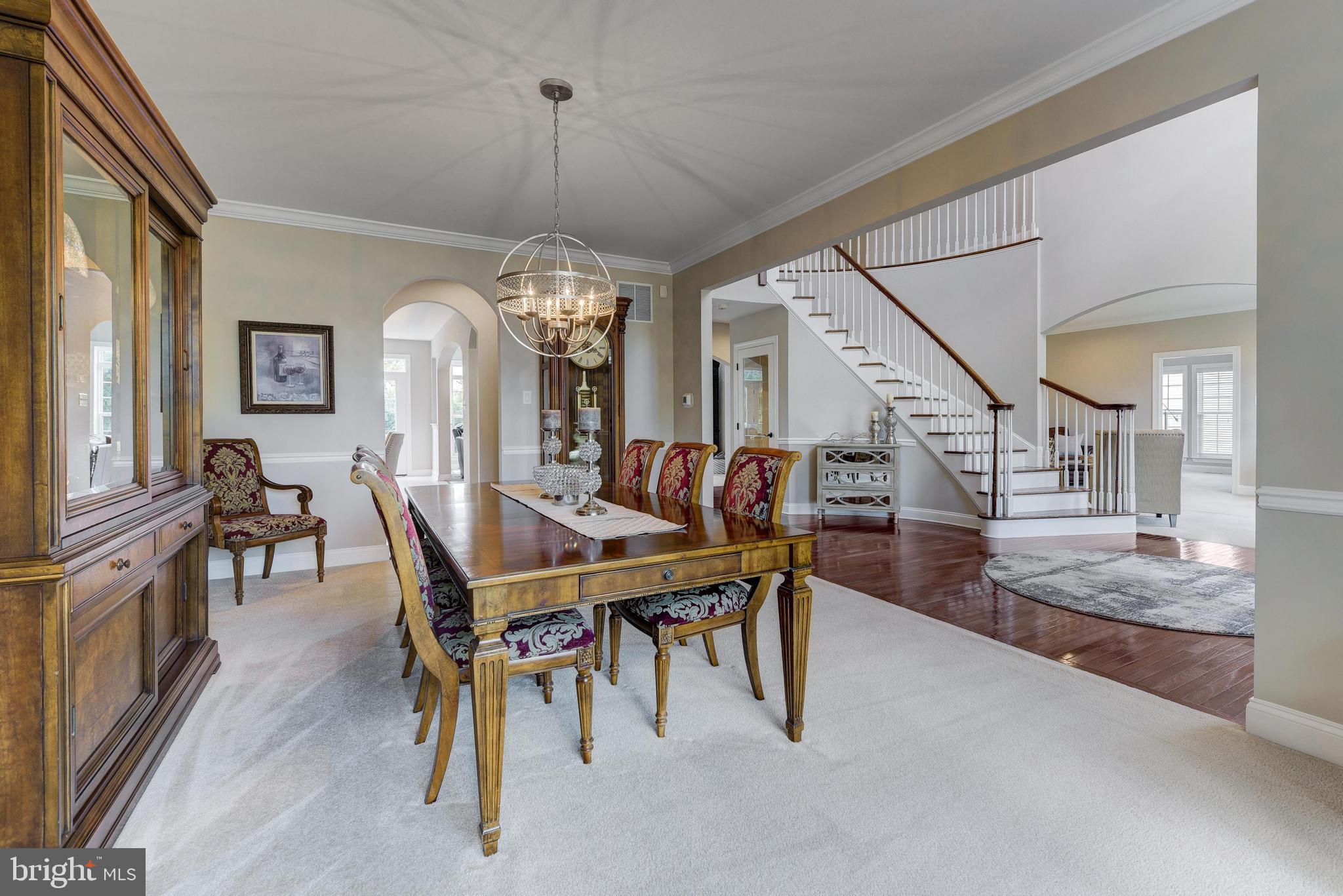 811 Castleton Drive Mickleton, NJ 08056 - Photo 22 of 52 a view of a dining room with furniture and a chandelier