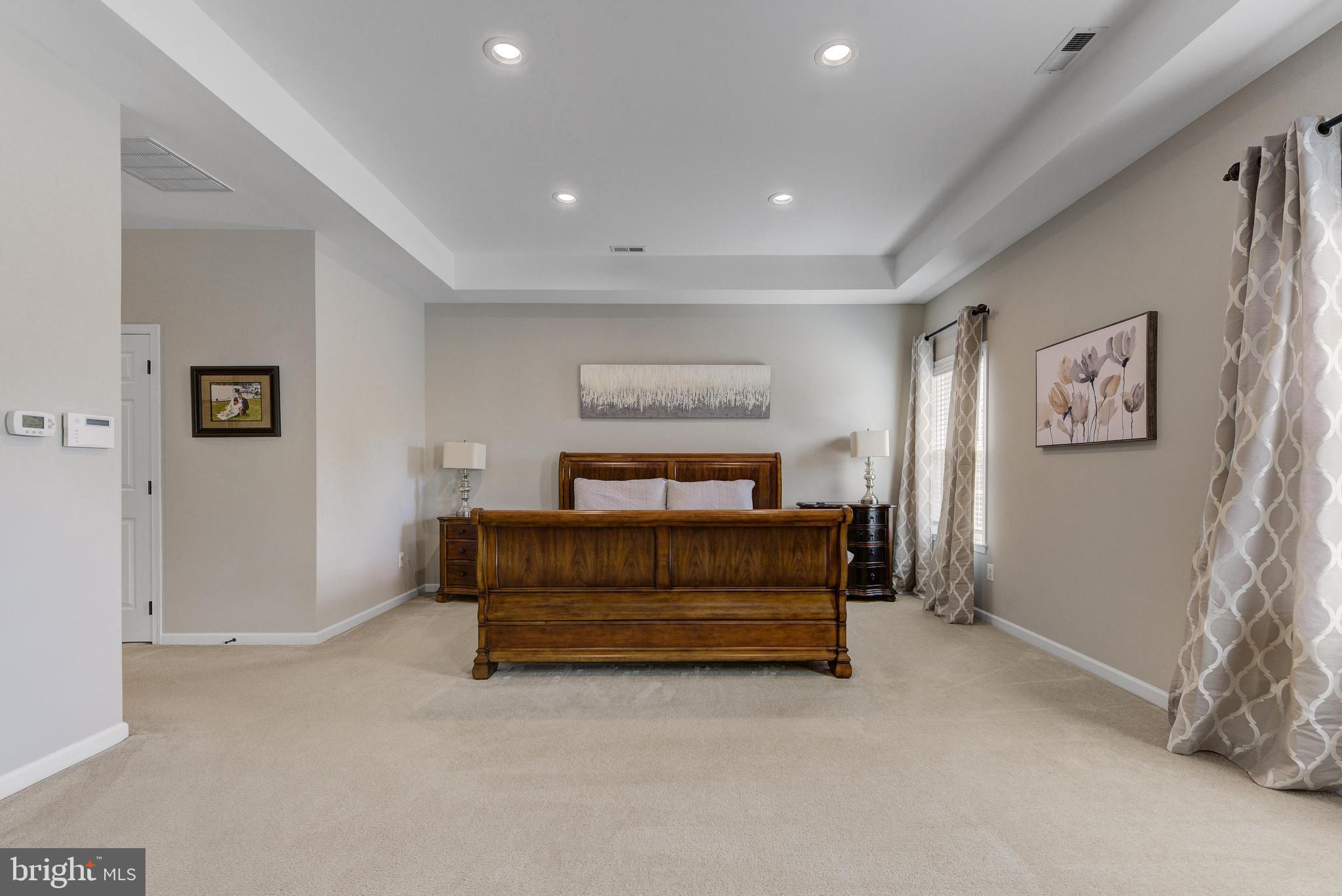 811 Castleton Drive Mickleton, NJ 08056 - Photo 27 of 52 a bedroom with a bed and a night stand