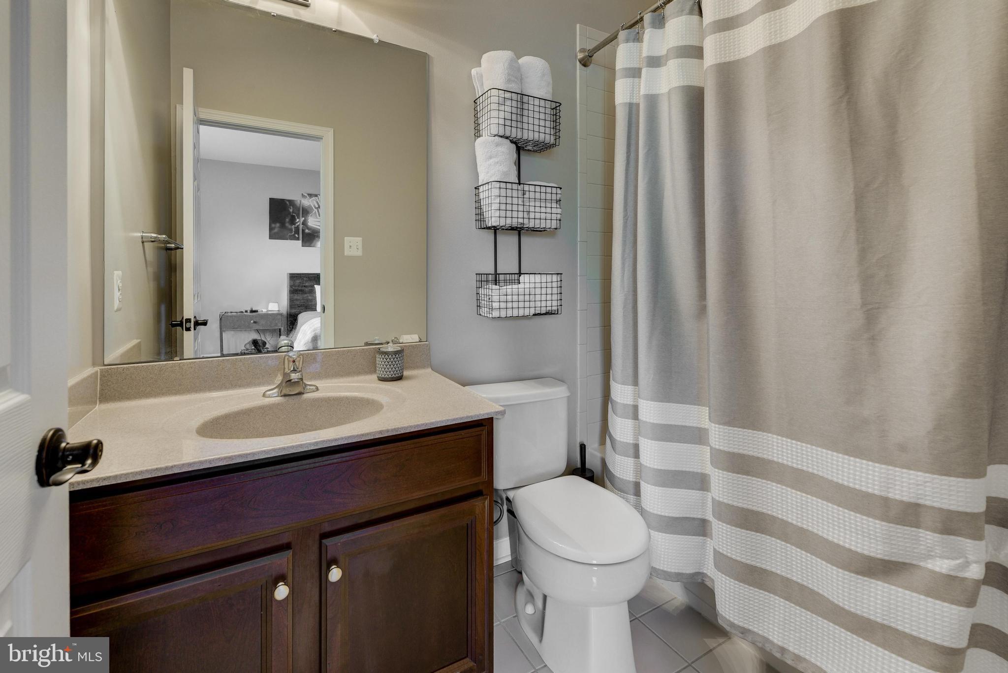 811 Castleton Drive Mickleton, NJ 08056 - Photo 33 of 52 a bathroom with a sink toilet and shower