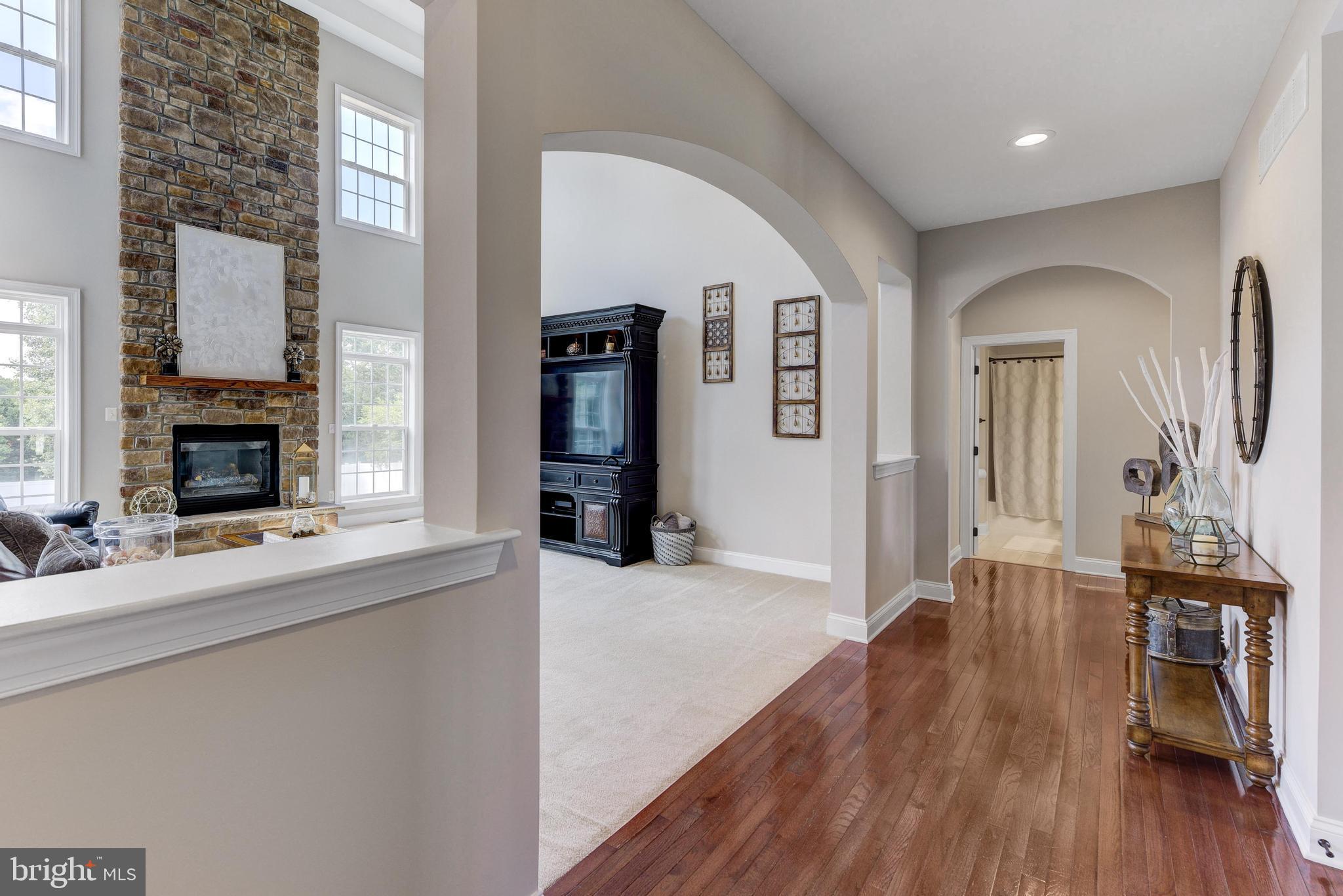 811 Castleton Drive Mickleton, NJ 08056 - Photo 10 of 52 a living room with furniture and a fireplace