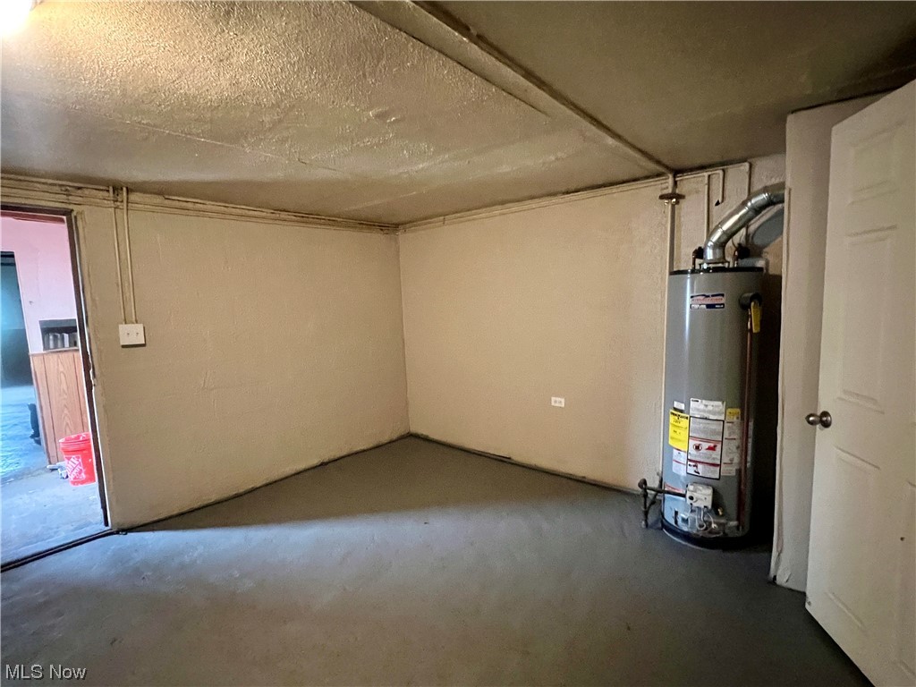 3923 Jaeger Road Lorain, OH 44053 - Photo 18 of 34 Basement featuring gas water heater and a textured ceiling
