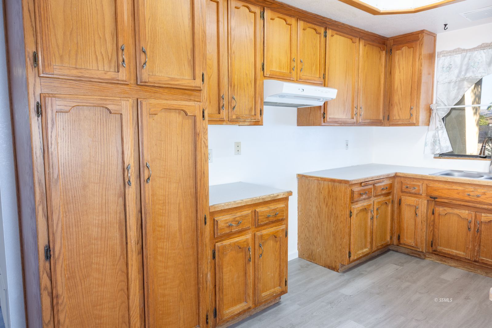 820 Walker Lane Ridgecrest, CA 93555 - Photo 13 of 27 a kitchen with granite countertop cabinets stainless steel appliances a sink and a window
