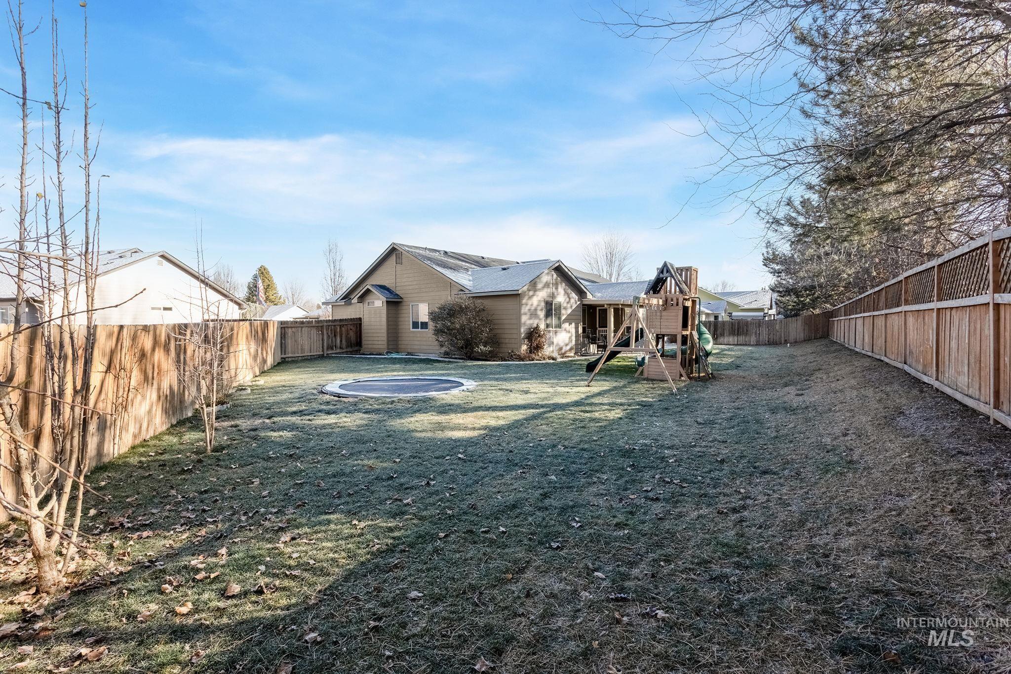 2217 East Satterfield Street Meridian, ID 83646 - Photo 28 of 33 Fenced backyard featuring a playground