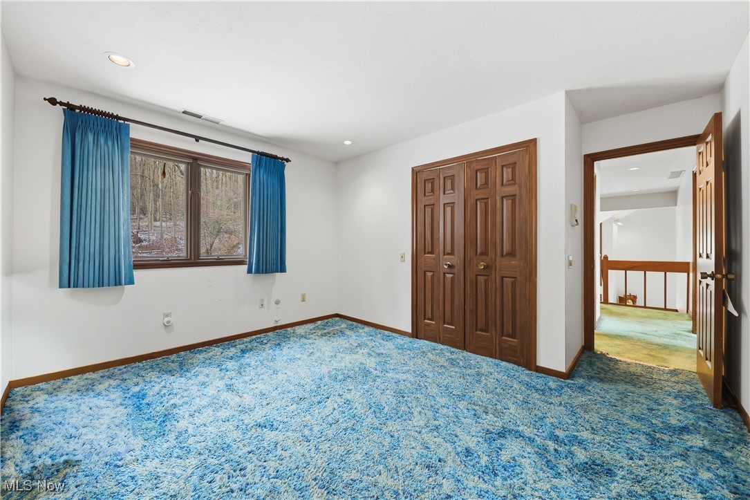 7014 River Styx Road Medina, OH 44256 - Photo 38 of 49 Unfurnished bedroom featuring carpet flooring, recessed lighting, and a closet