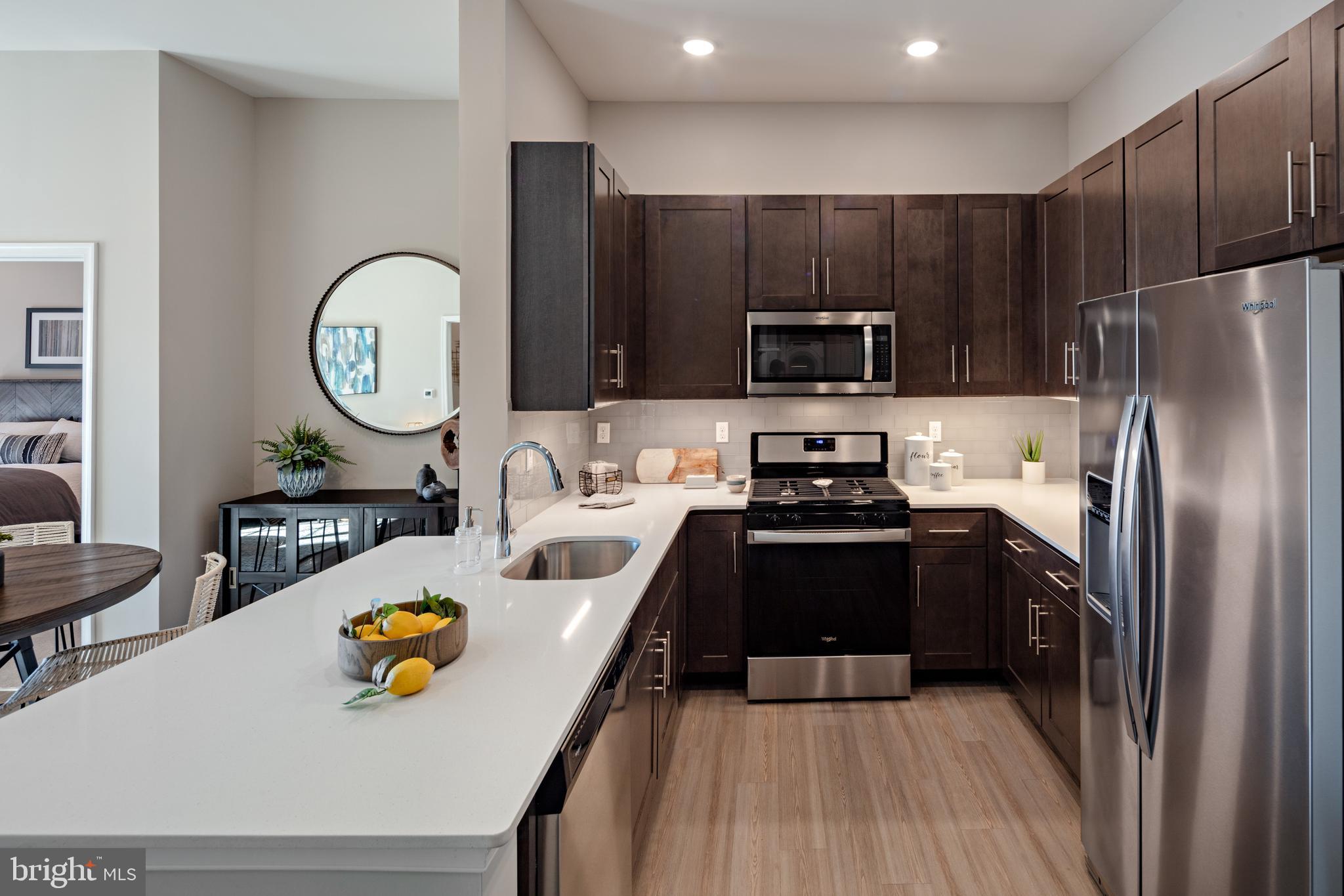 4921 Omaha Road Cherry Hill, NJ 08002 - Photo 15 of 16 a kitchen with sink refrigerator and stove
