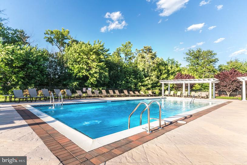4921 Omaha Road Cherry Hill, NJ 08002 - Photo 10 of 16 a view of a swimming pool with an outdoor seating and a yard
