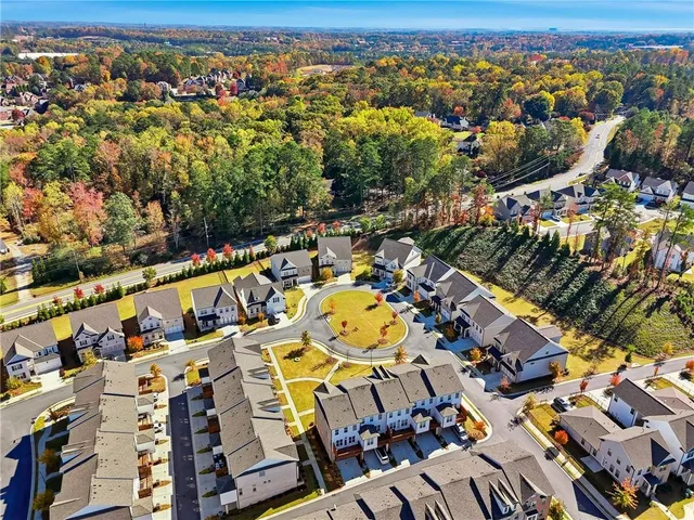 an aerial view of residential houses with outdoor space