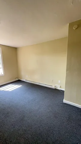an empty room with a hard wood floor