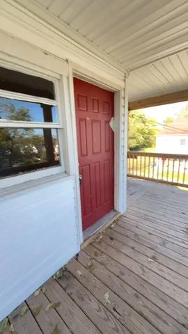a view of hallway with wooden floor