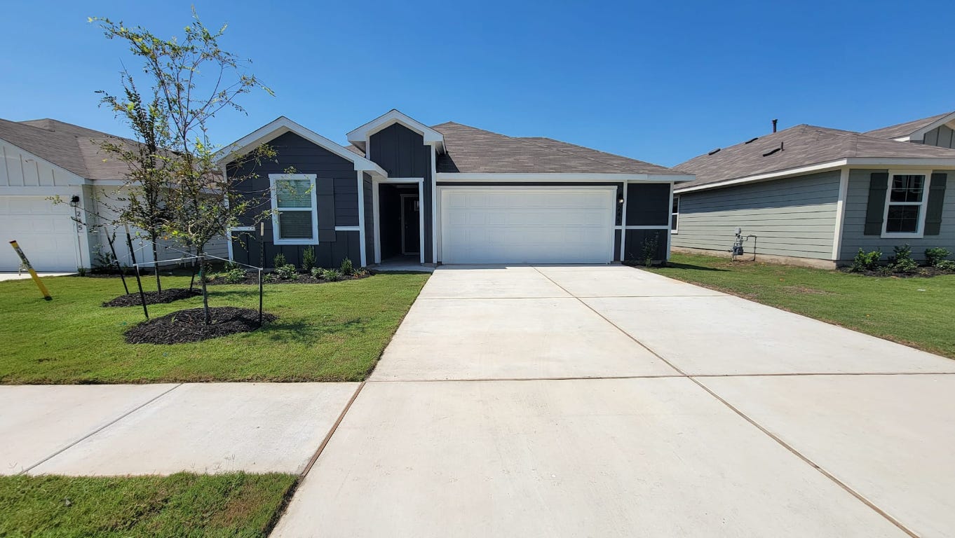 a front view of house with yard