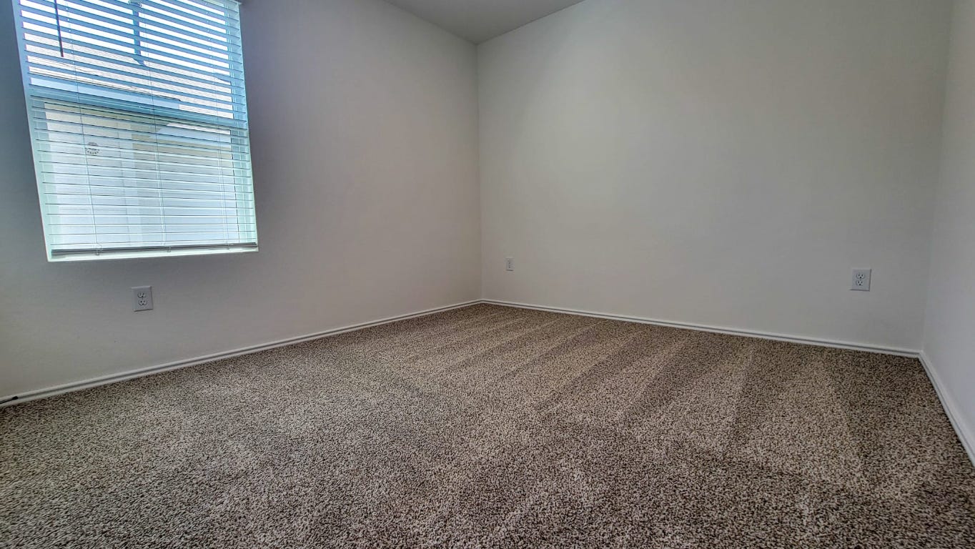 245 Texoma Street Kyle, TX 78640 - Photo 11 of 17 an empty room with a window