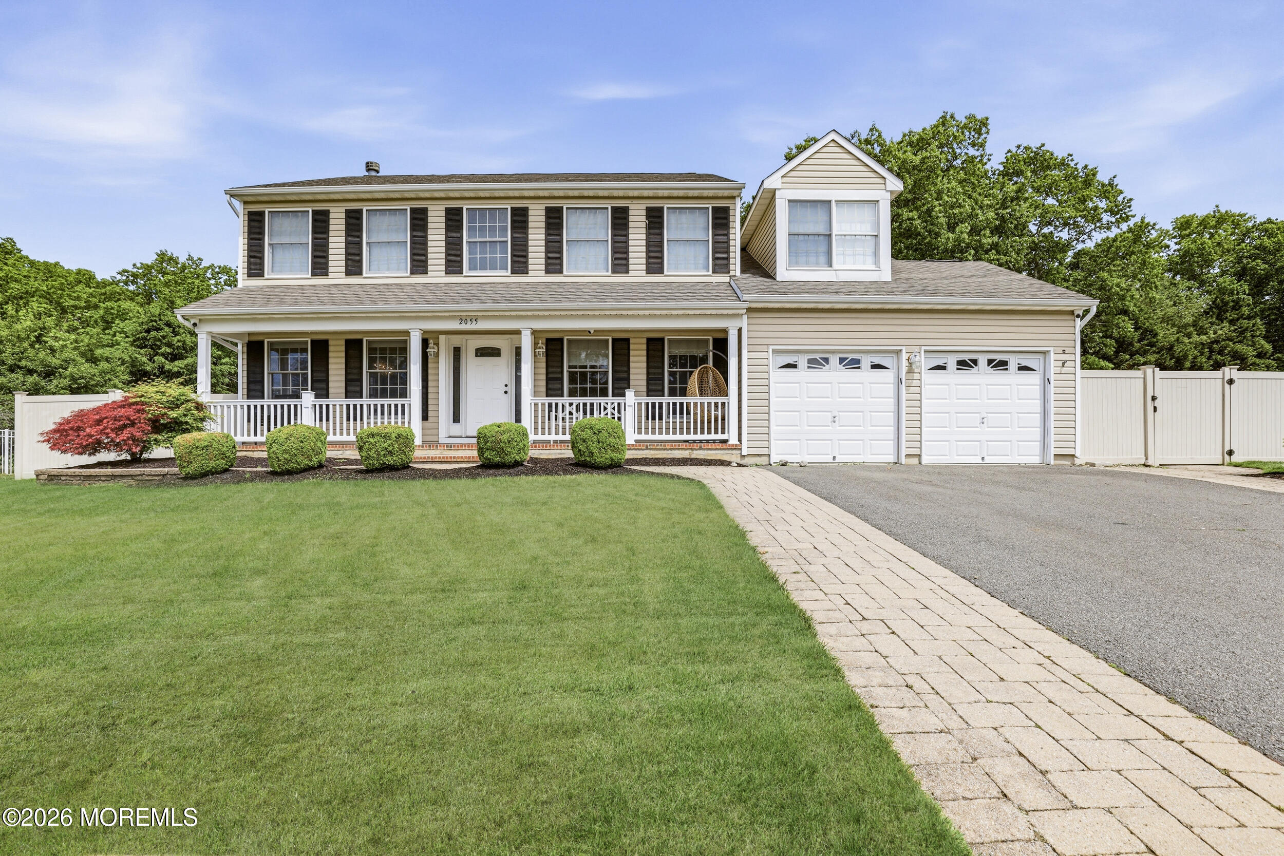 2055 MacKenzie Road Toms River, NJ 08755 - Photo 1 of 56 a front view of a house with a garden and plants