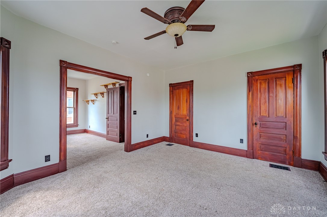 308 Yankee Road Middletown, OH 45044 - Photo 36 of 47 This versatile room features rich wood accents, soft carpet, and a charming ceiling fan.
