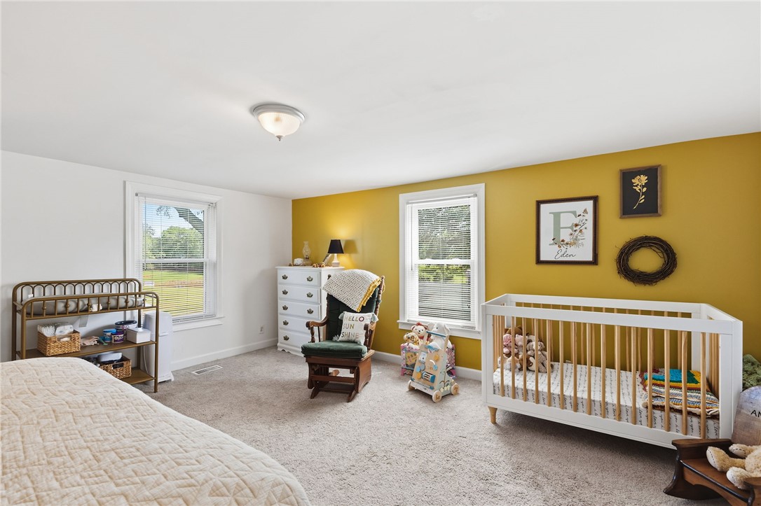 108 Tarrant Street Central, SC 29630 - Photo 24 of 42 A well-lit nursery features soft carpet and two windows that allow natural light into the space.
