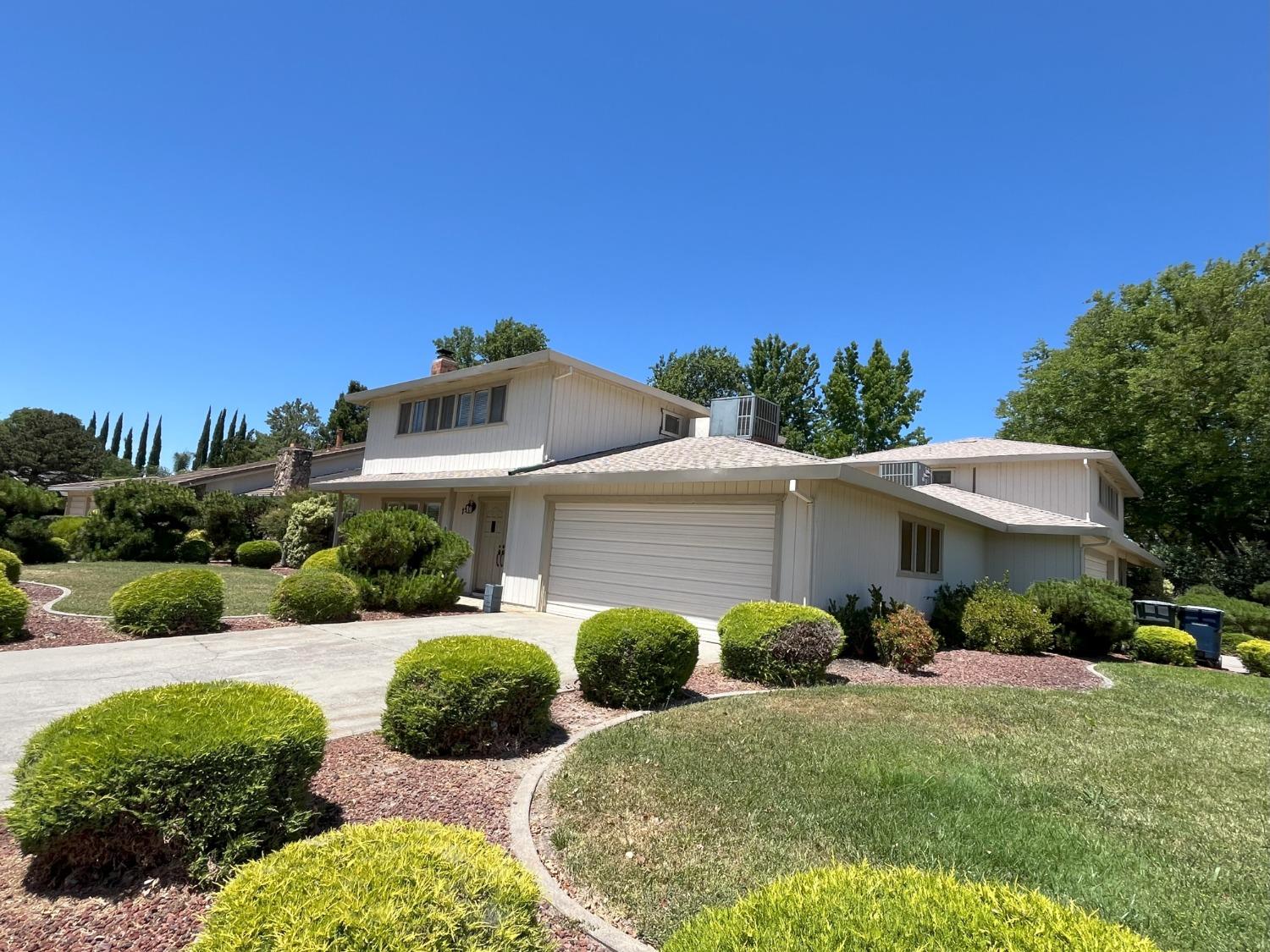 6836 Havenside Drive Sacramento, CA 95831 - Photo 1 of 1 a front view of a house with garden