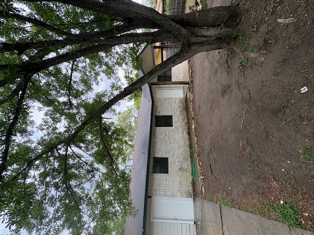 606 Guadalimar Street Lockhart, TX 78644 - Photo 2 of 11 a view of a house with a tree