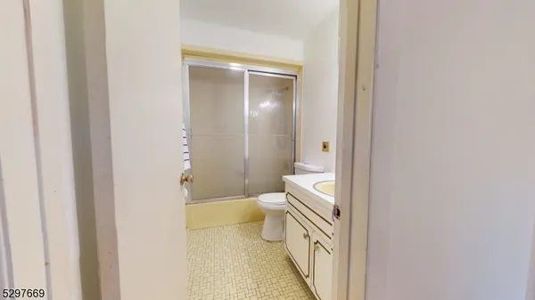 a bathroom with a toilet sink and a shower