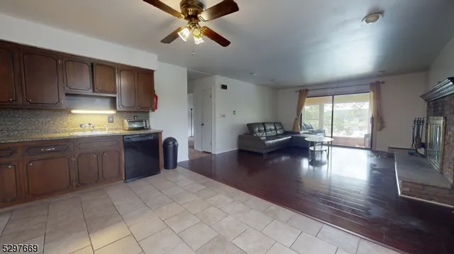 a kitchen with a counter top space appliances and cabinets