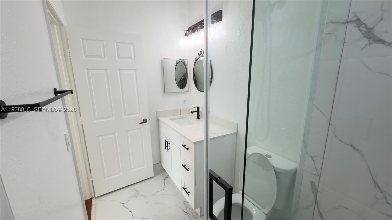 7633 Northwest 114th Path, Unit 7633 Doral, FL 33178 - Photo 12 of 30 a bathroom with a shower