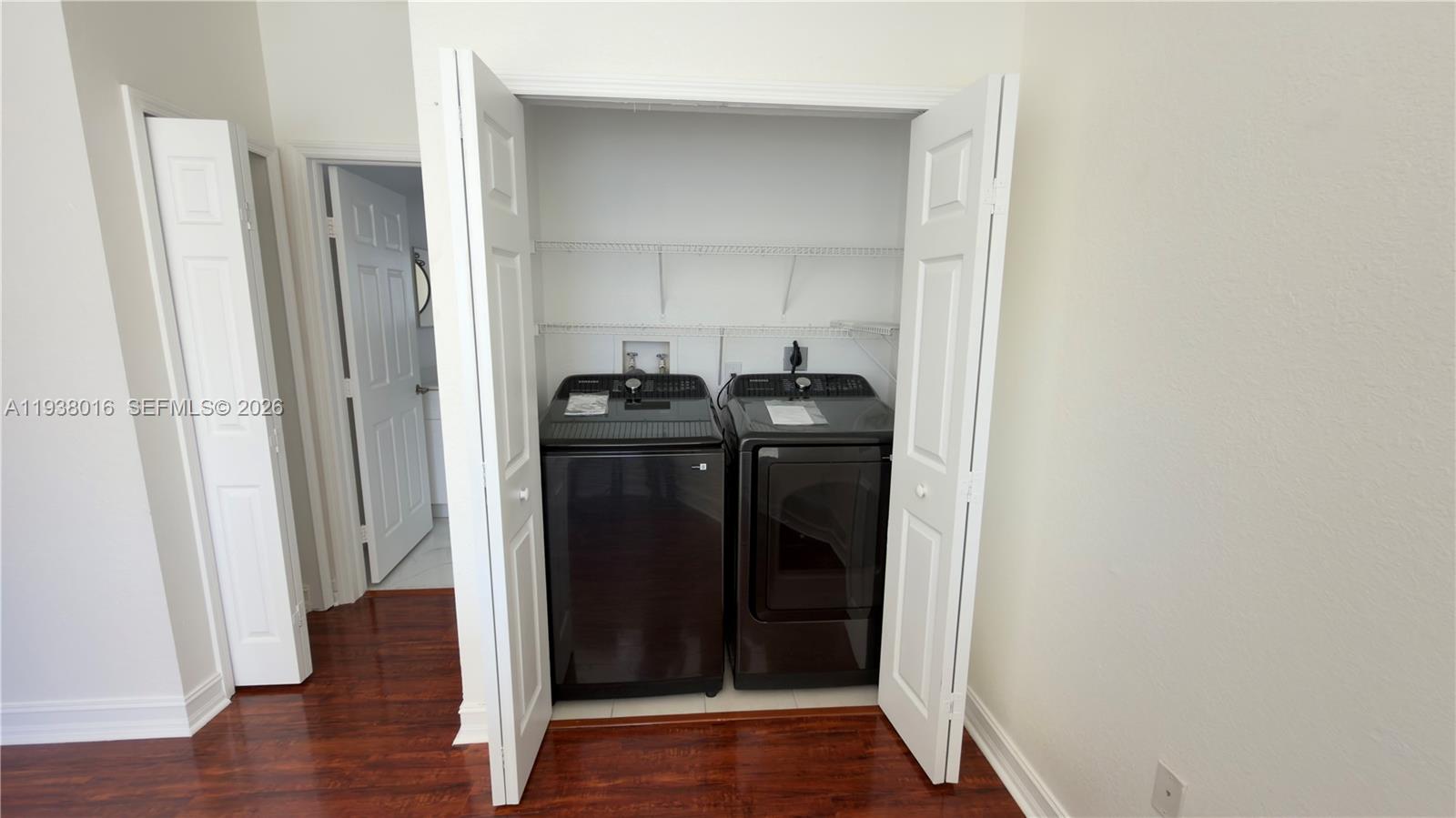7633 Northwest 114th Path, Unit 7633 Doral, FL 33178 - Photo 13 of 30 a view of a bathroom with wooden floor