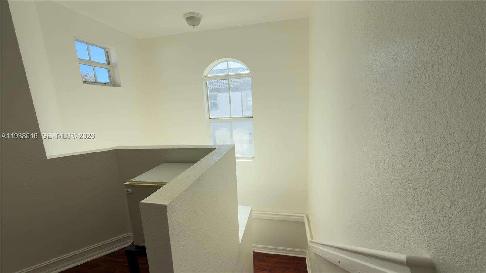 7633 Northwest 114th Path, Unit 7633 Doral, FL 33178 - Photo 16 of 30 a view of entryway with wooden floor