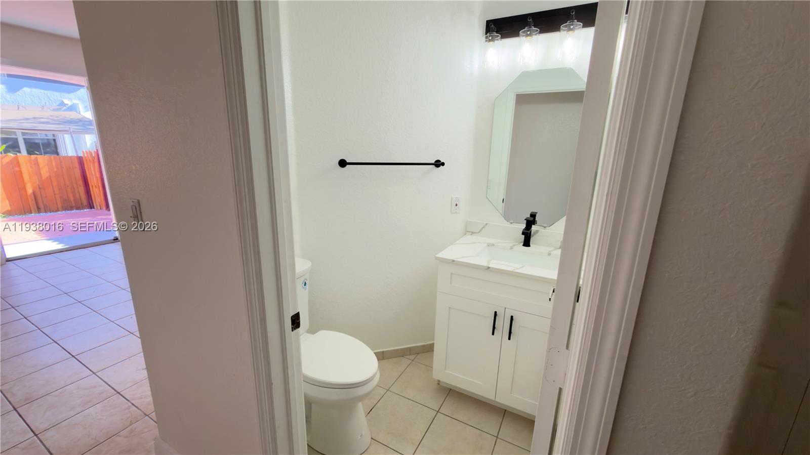 7633 Northwest 114th Path, Unit 7633 Doral, FL 33178 - Photo 17 of 30 a bathroom with a sink and toilet