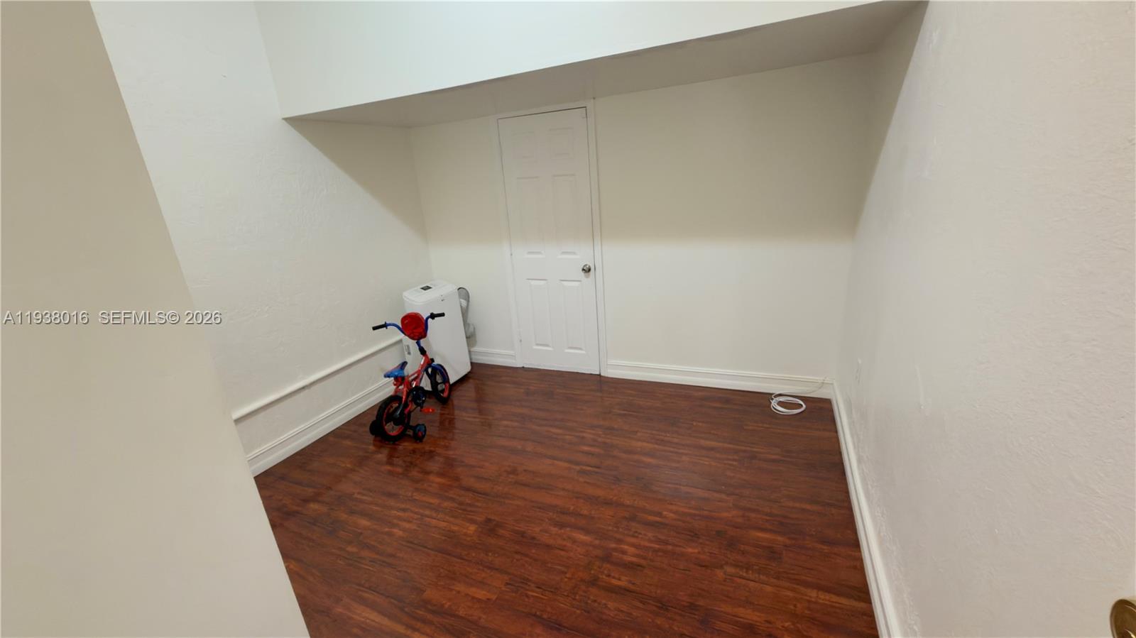 7633 Northwest 114th Path, Unit 7633 Doral, FL 33178 - Photo 19 of 30 a view of a room with wooden floor