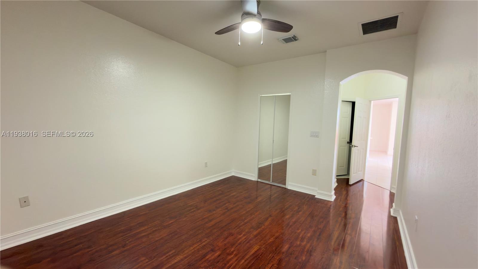 7633 Northwest 114th Path, Unit 7633 Doral, FL 33178 - Photo 23 of 30 an empty room with closet and wooden floor