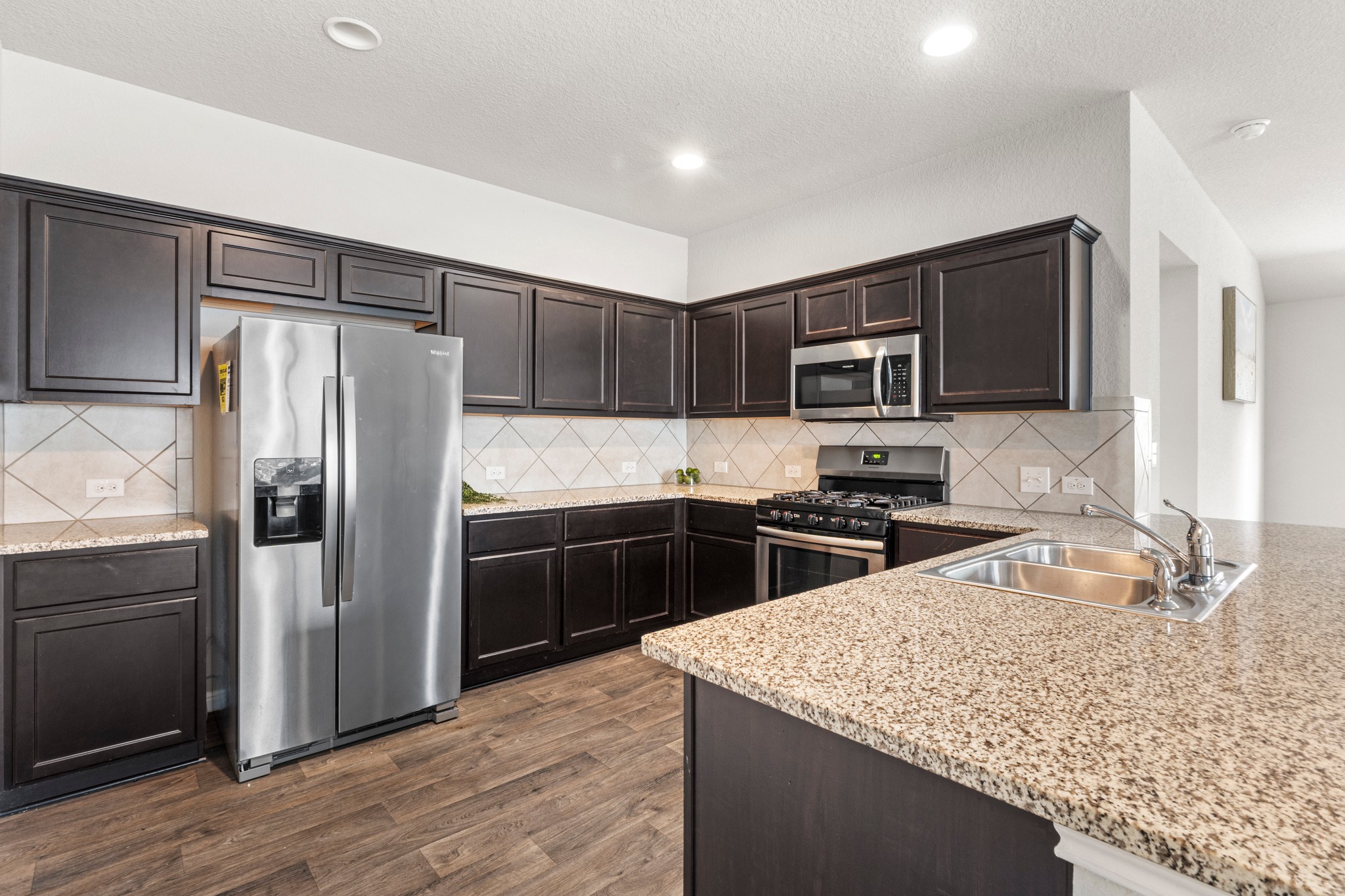 10809 Gonzales Ranger Pass Austin, TX 78754 - Photo 2 of 37 The kitchen comes ready to use with desirable contemporary finishes and a layout designed for the home chef.