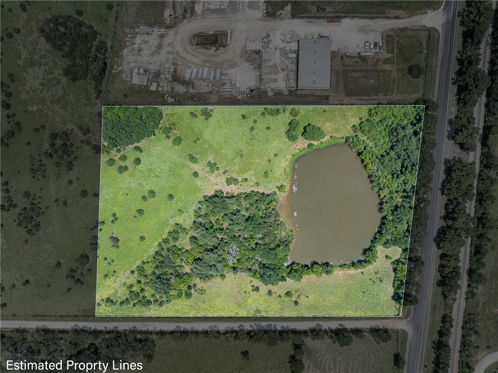 an aerial view of a residential houses with outdoor space