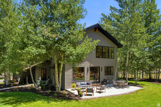 3027 Homestead Road Park City, UT 84098 - Photo 58 of 62 Contemporary exterior featuring gray siding, a dark-trimmed gable roof, and multiple large windows