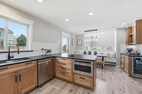 a kitchen with stainless steel appliances a stove and cabinets