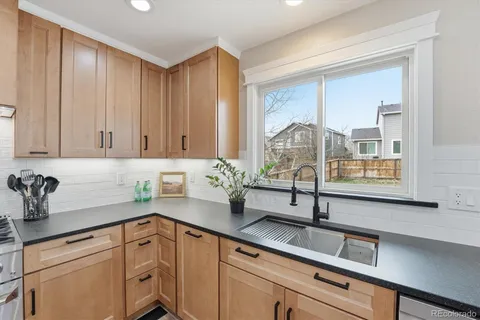 a kitchen with a sink and cabinets