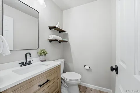 a bathroom with a sink and toilet