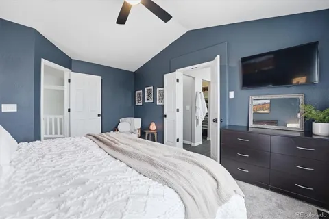 a bathroom with a double vanity sink a mirror and shower